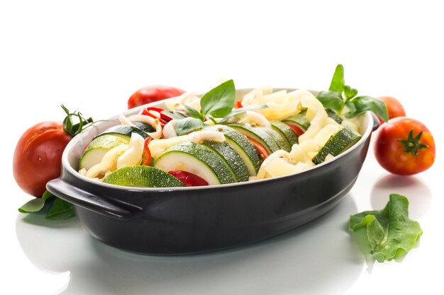 Fresh ingredients and prepared dish on a table
